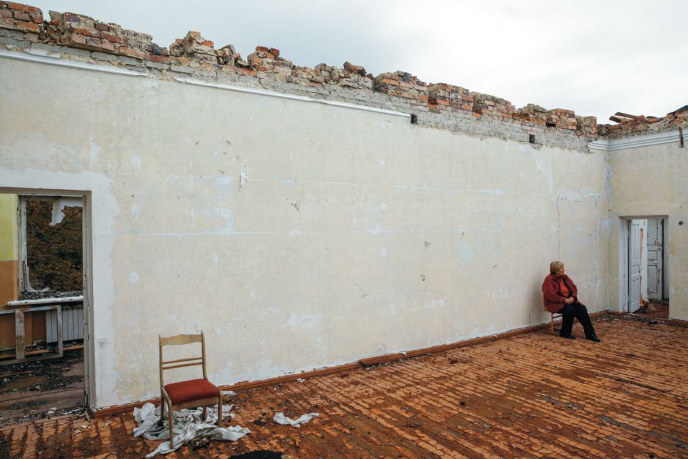 A caretaker in a school destroyed by rockets in the Donetsk region in 2017