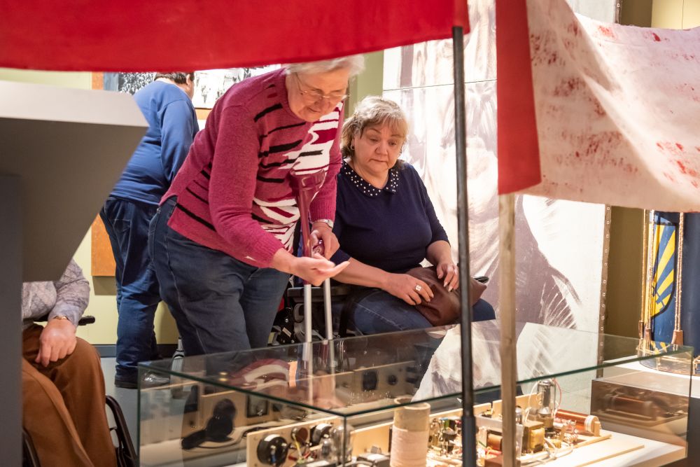 Visitors with walking impairments in the exhibition