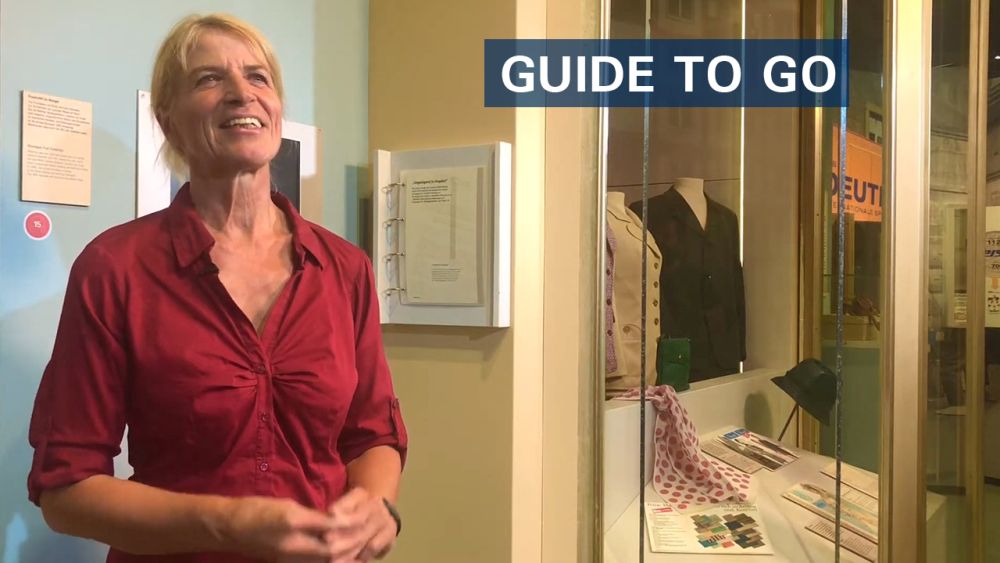 Thumbnail eines Videos der Videoreihe "Guide To Go" mit dem Foto einer Besucherbegleiterin