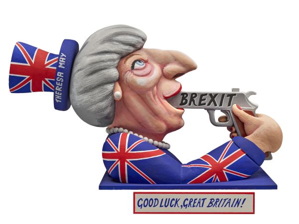 Eine Figur von Teresa May, gekleidet im Union Jack, die sich eine Pistole mit der Aufschrift Brexit in den Mund steckt.