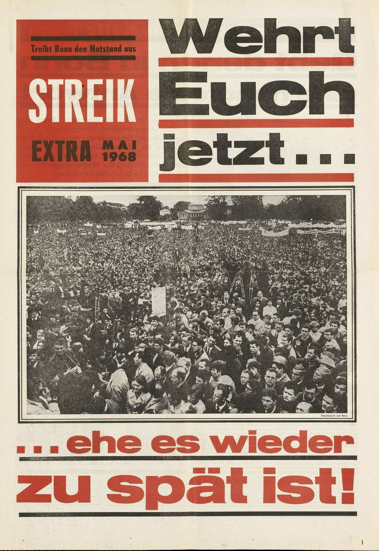 Zeitung: Vier Seiten, mehrfarbig, Texte und schwarz/weiß-Bilder. Auf der Titelseite Foto einer Protestkundgebung im Hofgarten in Bonn und der Aufruf Wehrt Euch jetzt, ehe es wieder zu spät ist!