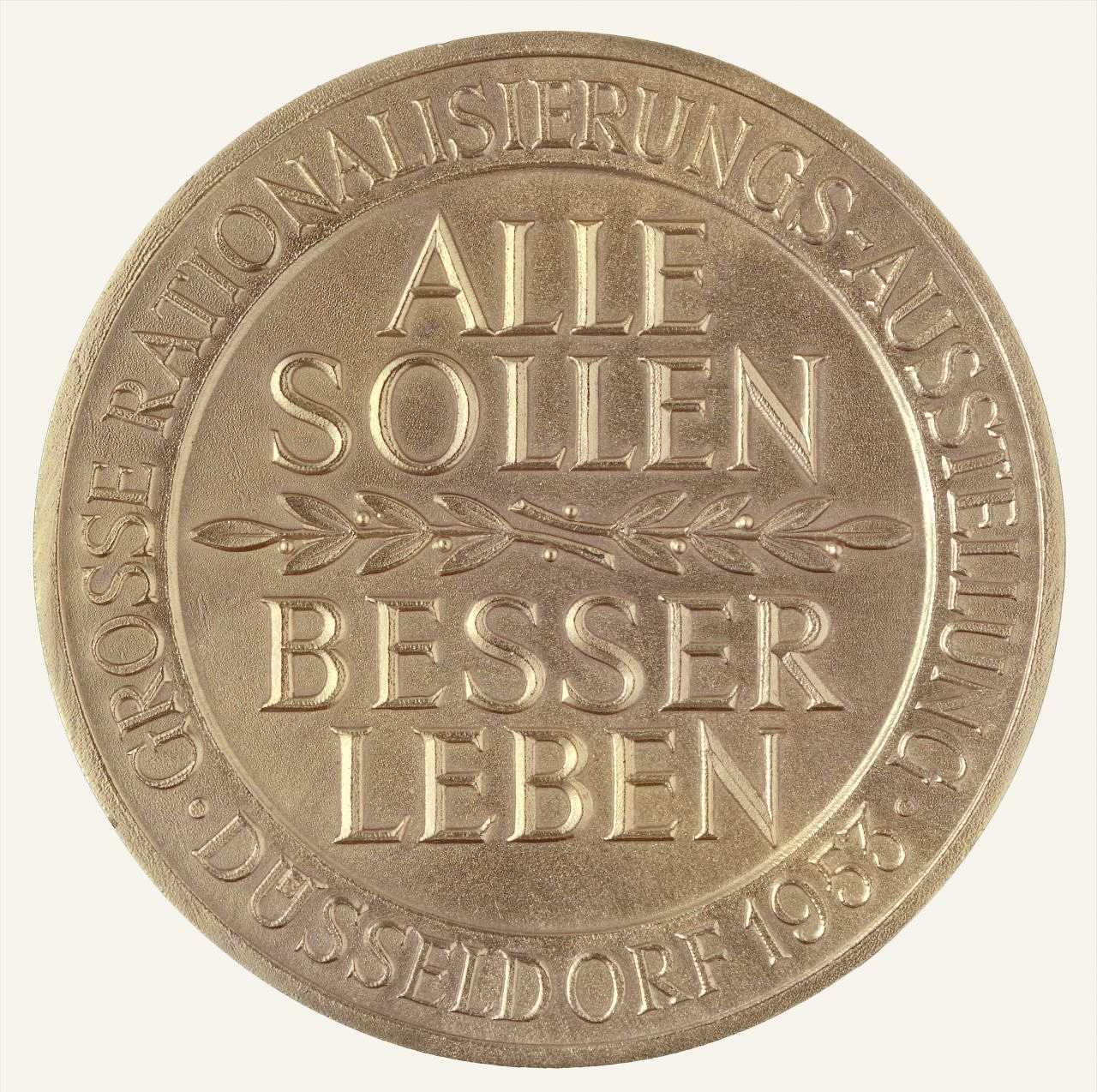 Vergoldete Bronzemedaille in Orginaletui; Vorderseite: Randstäbchen, erhabene Umschrift; Mittelmedaillon: 4-zeilige erhabene Inschrift, getrennt durch erhabenen Lorbeerzweig; Rückseite: Randstäbchen, umlaufender erhabener Lorbeerzweige; Mittelfeld: drei erhabene Wappen: Bundesrepublik, Nordrhein-Westfalen, Düsseldorf.