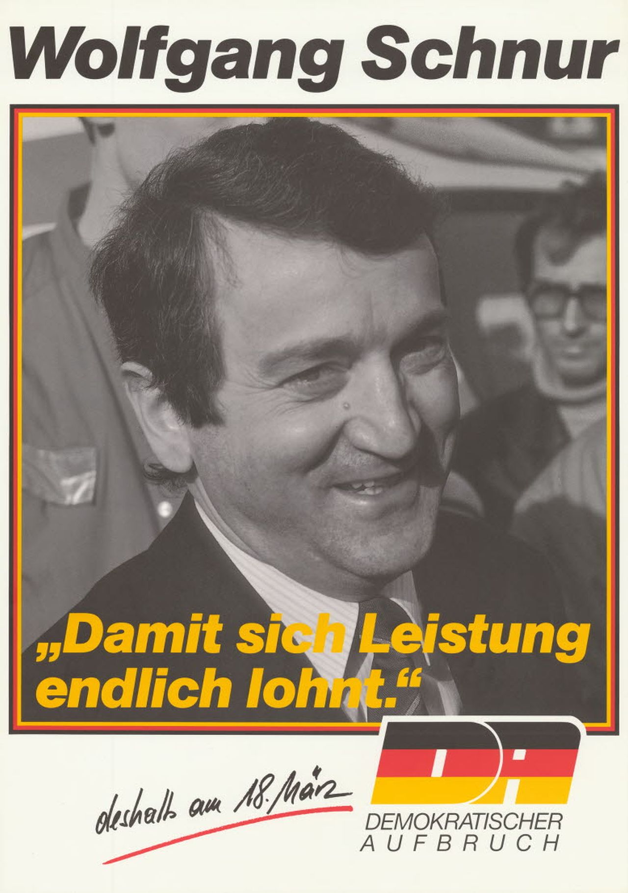 Das weißgrundige Plakat zeigt in einer schwarzrotgoldenen Umrandung ein Porträt des Kandidaten des Demokratischen Aufbruchs, Wolfgang Schnur. Darüber steht: 