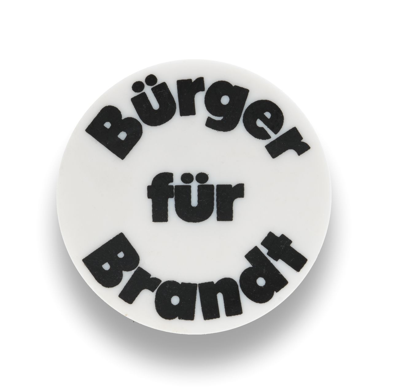 Button: Weißer Hintergrund mit schwarzer Schrift: Bürger für Brandt. Rückseite: Anstecknadel.